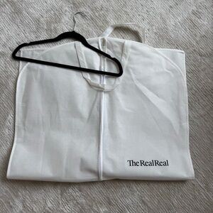 The Real Real White Garment Bag with Black Velvet Hanger